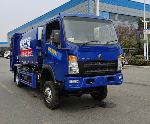 Một xe tải chở rác nén HOWO AWD 5CBM được vận chuyển đến Grenada.